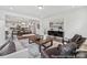 Spacious open-concept living room blending seamlessly with the dining area and kitchen at 510 Black Bear St # 145P, China Grove, NC 28023