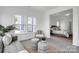 Stylish living room with ample natural light and view to a bedroom for open concept appeal at 510 Black Bear St # 145P, China Grove, NC 28023