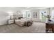 Airy primary bedroom with large windows and neutral décor at 510 Black Bear St # 145P, China Grove, NC 28023
