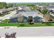Stunning aerial view of a home with a well-maintained lawn, mature trees, and landscaping in a desirable neighborhood at 5103 Looking Glass Trl, Denver, NC 28037