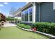 Lush putting green and outdoor living area with stone accents, beautifully manicured shrubs, and verdant lawn at 5103 Looking Glass Trl, Denver, NC 28037
