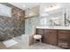 Bathroom with tiled walk-in shower, vanity, and a stool at 5103 Looking Glass Trl, Denver, NC 28037
