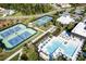 Aerial view of community amenities including tennis courts and a sparkling swimming pool with lounge areas at 5103 Looking Glass Trl, Denver, NC 28037