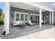 Covered patio featuring ample seating for relaxing and a ceiling fan for warmer days at 5103 Looking Glass Trl, Denver, NC 28037