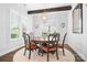 Elegant dining room with wood floors, beamed ceilings, and a chandelier at 5103 Looking Glass Trl, Denver, NC 28037