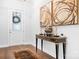 Elegant entryway with hardwood floors, decorative lighting, and a stylish console table at 5103 Looking Glass Trl, Denver, NC 28037