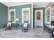 Charming front porch with comfortable seating, stylish decor, and a welcoming entrance at 5103 Looking Glass Trl, Denver, NC 28037