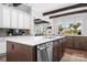 Gourmet kitchen featuring a large island, stainless steel appliances, and breakfast bar seating at 5103 Looking Glass Trl, Denver, NC 28037