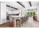 Open kitchen with an island bar, lots of storage, and natural light that enhances the space at 5103 Looking Glass Trl, Denver, NC 28037
