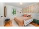 Cozy bedroom with natural light, hardwood floors, and fun decor at 5218 Addison Dr, Charlotte, NC 28211