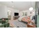 Bright bedroom with two chairs and hardwood floors at 5218 Addison Dr, Charlotte, NC 28211