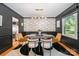 Modern dining room with stylish decor, dark walls, and statement lighting at 5218 Addison Dr, Charlotte, NC 28211