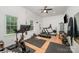 Home gym includes treadmill, bike, free weights and ceiling fan at 5218 Addison Dr, Charlotte, NC 28211