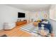Inviting living room with wood paneled wall, stylish furniture, and hardwood floors at 5218 Addison Dr, Charlotte, NC 28211