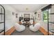 Bright living room with modern decor, hardwood floors, and ample natural light at 5218 Addison Dr, Charlotte, NC 28211