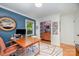Comfortable office space features desk, chair, area rug, and natural light at 5218 Addison Dr, Charlotte, NC 28211
