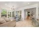Bright sunroom with large windows, dining area, and cozy seating area at 5218 Addison Dr, Charlotte, NC 28211