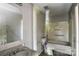 Bathroom needs repair, featuring a tub, toilet, sink and mirror in disrepair at 5219 Biederbeck Dr, Charlotte, NC 28212