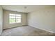 This is a picture of an empty bedroom, with a window that lets in natural light at 5219 Biederbeck Dr, Charlotte, NC 28212