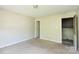 A standard bedroom with light walls, carpet, and natural light from the window at 5219 Biederbeck Dr, Charlotte, NC 28212