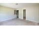 Standard bedroom with carpet, light walls and two door ways at 5219 Biederbeck Dr, Charlotte, NC 28212