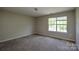 Bright bedroom featuring a window that lets in natural light at 5219 Biederbeck Dr, Charlotte, NC 28212