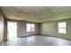 Large living room with an open door and natural light from the windows at 5219 Biederbeck Dr, Charlotte, NC 28212