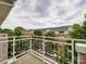 Balcony view overlooking community with trees and parked cars below at 650 Raphael Pl, Charlotte, NC 28205