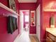 Bathroom features a white-tiled floor, pink walls and a framed mirror at 650 Raphael Pl, Charlotte, NC 28205