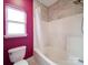 Bathroom showcases a shower-tub combo with tiled backsplash and toilet nearby at 650 Raphael Pl, Charlotte, NC 28205