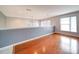 Upstairs bonus room with hardwood floors and sun-filled windows at 650 Raphael Pl, Charlotte, NC 28205