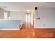 Bonus room features hardwood floors, recessed lighting, and views of hallway at 650 Raphael Pl, Charlotte, NC 28205