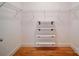 Walk-in closet with wood floors and adjustable white wire shelving at 650 Raphael Pl, Charlotte, NC 28205