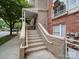 Exterior view of the condo entrance with stone steps and brick accents at 650 Raphael Pl, Charlotte, NC 28205