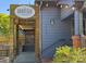 Inviting restaurant exterior featuring a wooden entryway, string lights, and stylish architecture at 650 Raphael Pl, Charlotte, NC 28205