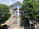 Modern condo building with stone facade, balconies, and ample natural light at 650 Raphael Pl, Charlotte, NC 28205