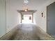 Empty garage with an open door and a view of another garage at 650 Raphael Pl, Charlotte, NC 28205