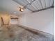 Empty garage with paint cans on shelving at 650 Raphael Pl, Charlotte, NC 28205