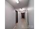 Hallway with concrete floors and gray walls at 650 Raphael Pl, Charlotte, NC 28205
