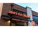 Exterior view of Jeni's Ice Creams shop with lit signage on a brick building at 650 Raphael Pl, Charlotte, NC 28205