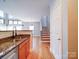 Kitchen with stainless appliances and view to living room at 650 Raphael Pl, Charlotte, NC 28205