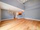 Open-concept living space with hardwood floors, high ceilings, and modern lighting at 650 Raphael Pl, Charlotte, NC 28205