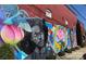 Vibrant mural on brick wall adding an artistic touch to the building's exterior at 650 Raphael Pl, Charlotte, NC 28205