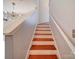 Bright staircase with wooden steps and modern light fixture visible at 650 Raphael Pl, Charlotte, NC 28205