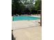 A pristine swimming pool is surrounded by lounge chairs on a sunny day at 650 Raphael Pl, Charlotte, NC 28205