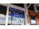 The Evening Muse storefront featuring a vintage sign and entrance at 650 Raphael Pl, Charlotte, NC 28205