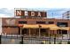 Outdoor seating area at Wooden Robot Brewery featuring picnic tables and sunshades at 650 Raphael Pl, Charlotte, NC 28205