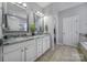 Bathroom featuring dual sinks, granite countertops, and a separate bathtub and shower at 7123 Meyer Rd, Fort Mill, SC 29715