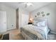 Bedroom with neutral walls, carpet, and a comfortable bed accented by decorative pillows and wall mirrors at 7123 Meyer Rd, Fort Mill, SC 29715