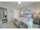Bedroom with closet, floral linens, carpet and ceiling fan at 7123 Meyer Rd, Fort Mill, SC 29715